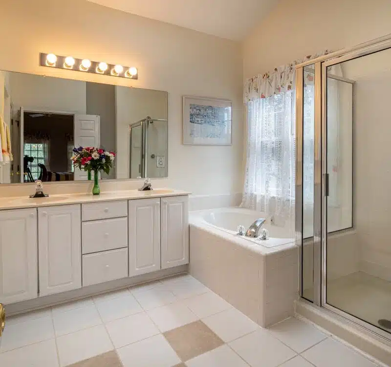 A luxurious bathroom with a bathtub and a shower.